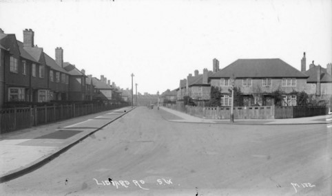 Fig. 16: Lidiard Road, note the immature planting of the gardens, especially on this corner plot which is now overgrown.