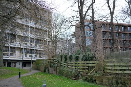 Fig. 109: Chadwick Hall and one of the slab blocks Binley House, with the boundary fence in the foreground