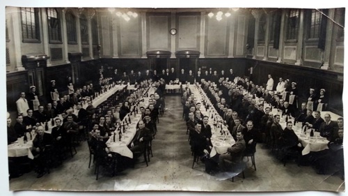 long dinner tables on black and white photo for Revisiting 'The Dinner' event