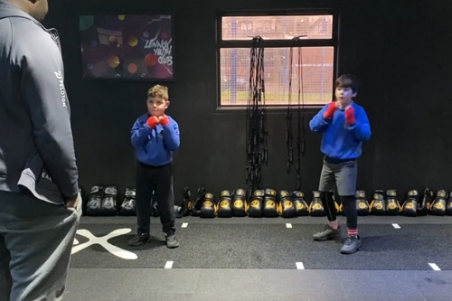 Two ten-year-old boys train at Lennox boxing gym